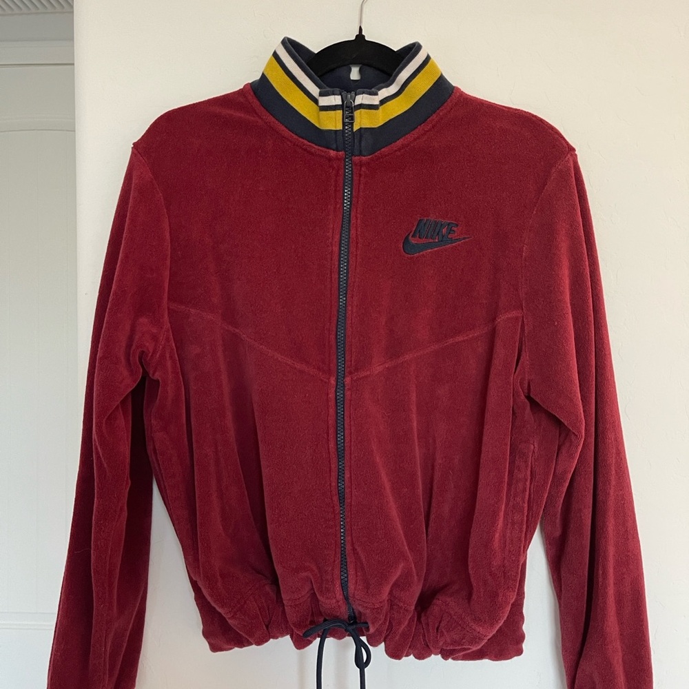 Nike Burgundy terry zip up. Striped funnel neck, drawstring wast.
